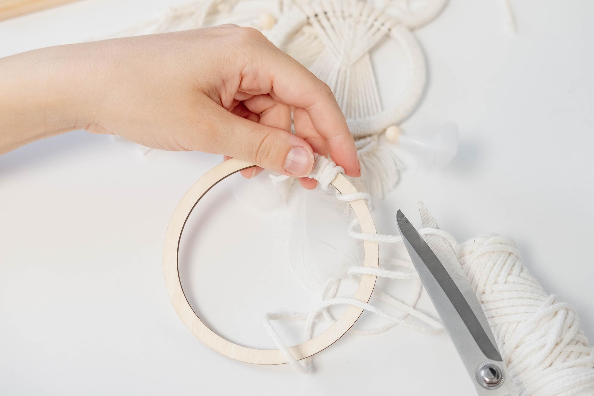 Hands embroidering on a hoop